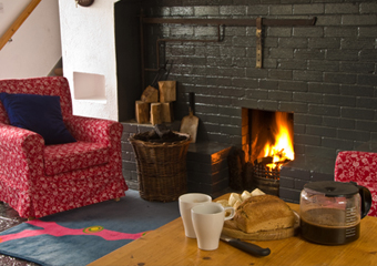 Interior, fire lit at the Old Deanery Cottages, Killala.